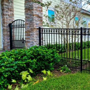 Aluminum fence with puppy panel accent - offers secuirty and safety for your loved animials